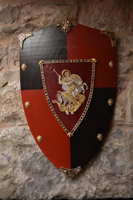 Lot 208 - A reproduction painted wood armorial shield,...