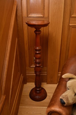 Lot 262 - A reproduction mahogany torchere, the circular...