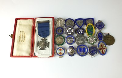 Lot 91 - A collection of sixty-three silver and enamelled nursing medals