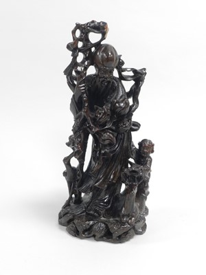 Lot 272 - A Chinese carved and inlaid wooden figure of Shoulao