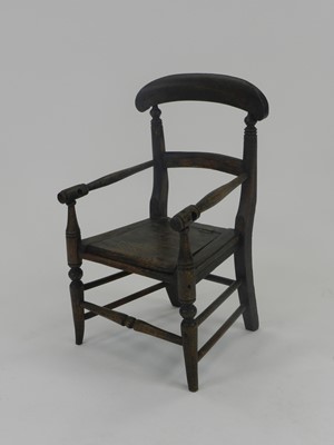 Lot 431 - A 19th century beech and ash child's elbow chair/commode