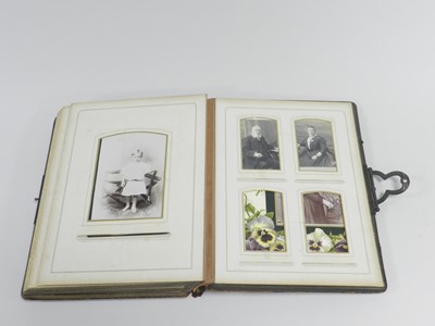 Lot 335 - An Edwardian photograph album, leather bound,...