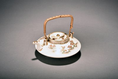 Lot 373 - A Japanese Satsuma teapot and cover