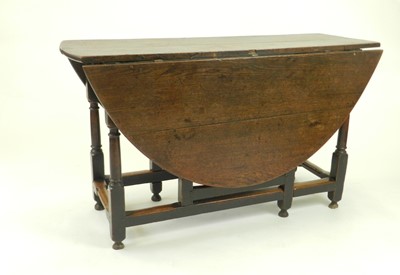 Lot 441 - A 19th century oak gateleg drop-leaf table,...