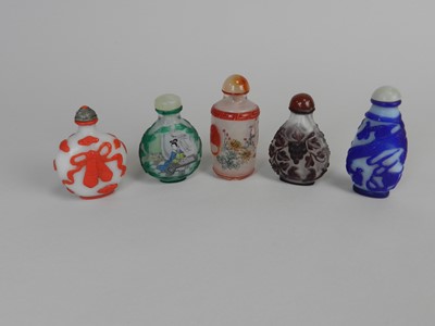 Lot 290 - Five Chinese cameo glass snuff bottles, 20th...