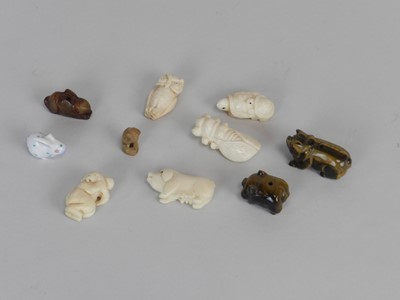 Lot 293 - A group of small Chinese and other carved bone...