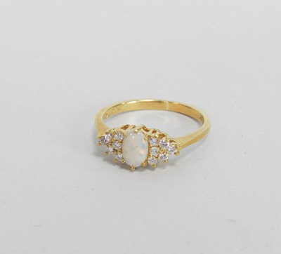 Lot 39 - An 18ct gold opal and diamond cluster ring