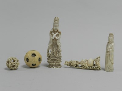 Lot 306 - Two Chinese carved ivory figures, two puzzle balls, one lacking majority of concentric balls, a double gourd being pulled by figures and a barge (6)