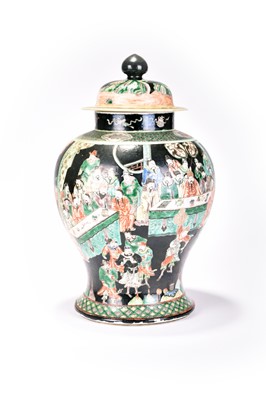 Lot 265 - A Chinese famille noir jar and cover, Kangxi...