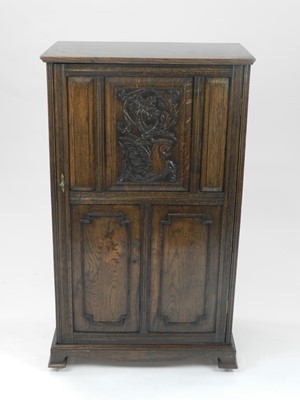 Lot 452 - An Edwardian oak collector's or music cabinet,...