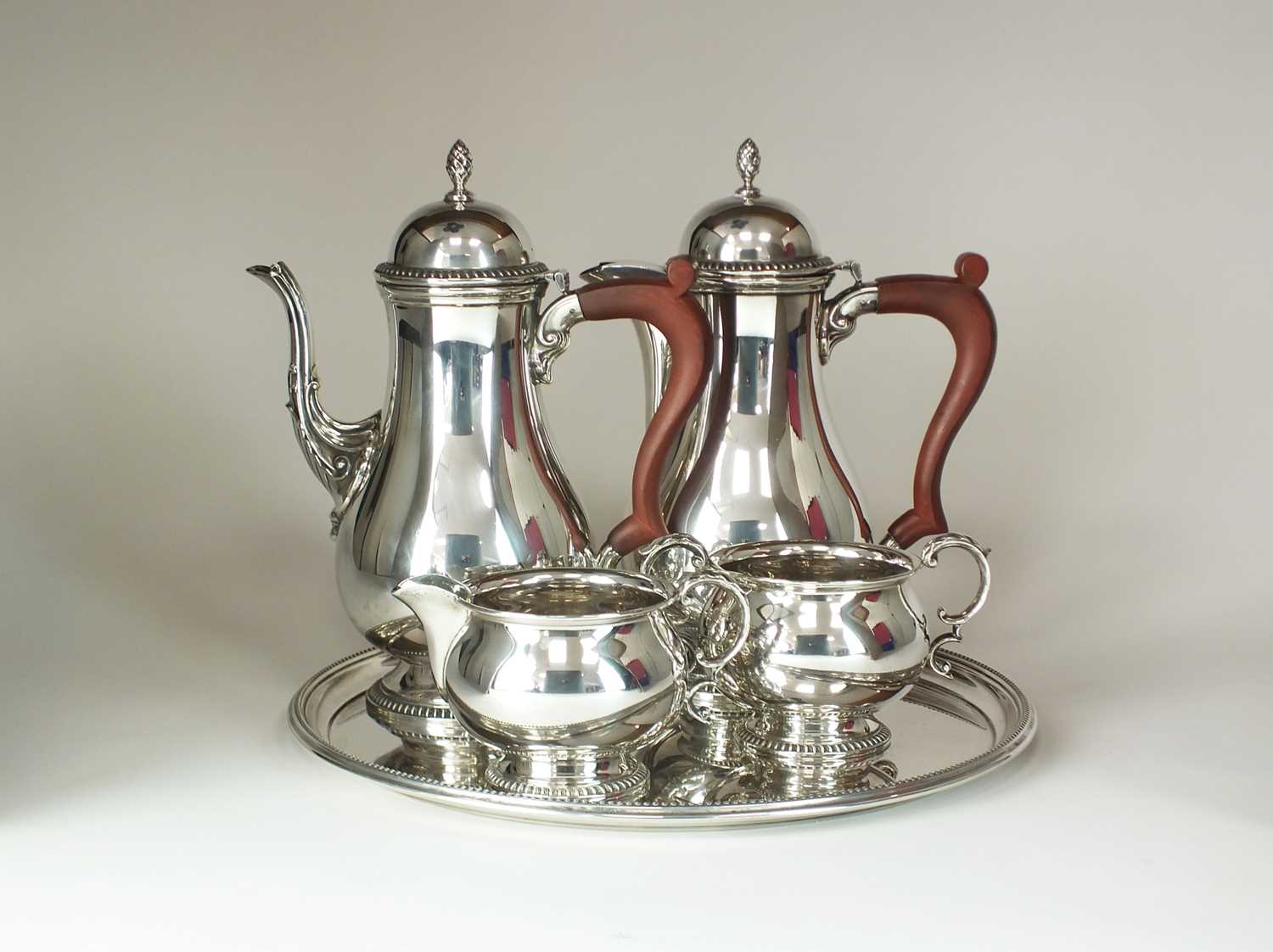 Lot 23 - A George III style four piece silver coffee service and tray