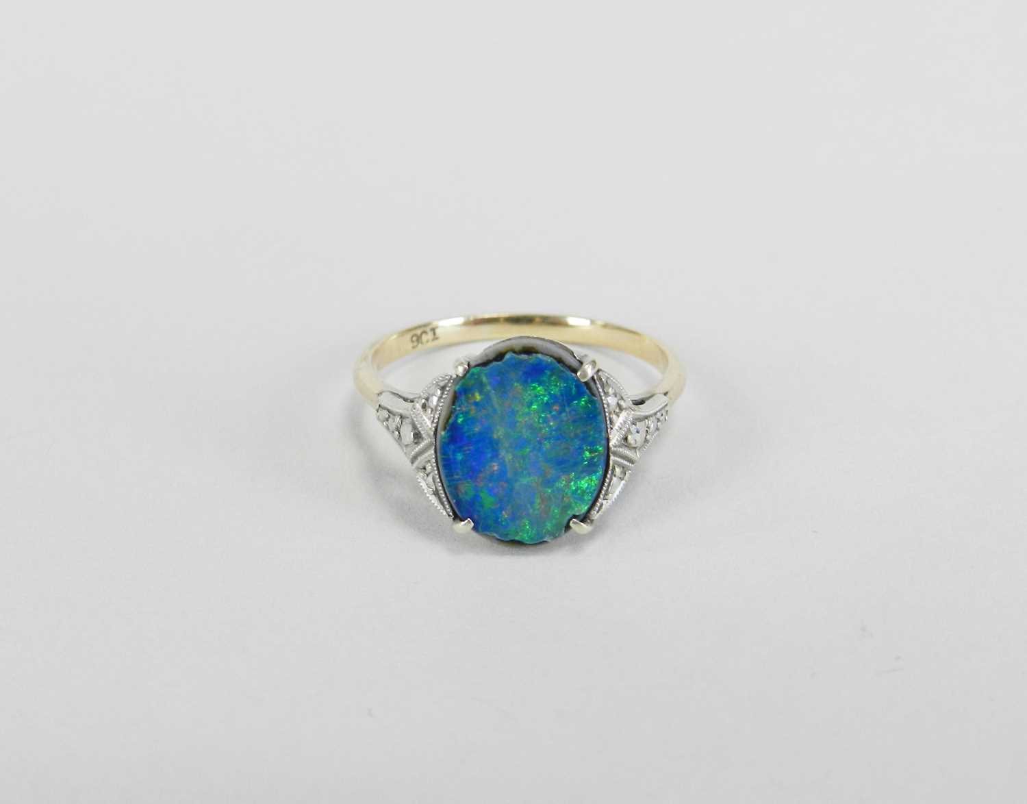 Lot 354 - A single stone black opal doublet ring