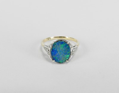 Lot 354 - A single stone black opal doublet ring