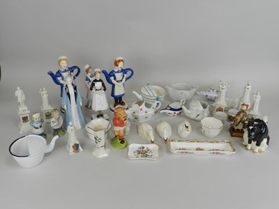 Lot 228 - A collection of porcelain figures of nurses...