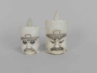 Lot 299 - A pair of Japanese carved ivory snuff pots,...