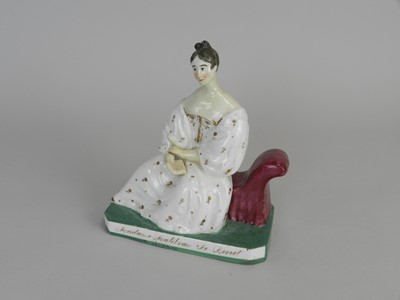 Lot 391 - A rare Staffordshire porcelain figure of...