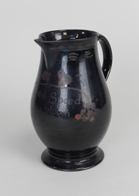 Lot 399 - A Jackfield black-glazed baluster jug circa...