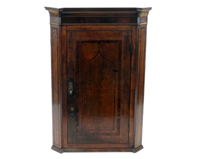 Lot 503 - A George III oak and mahogany crossbanded and banded hanging corner cupboard