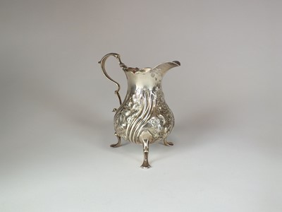 Lot 144 - An early George III silver cream jug