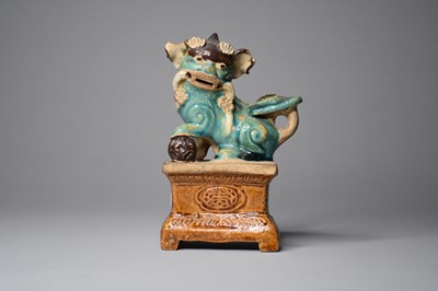 Lot 269 - A Chinese sancai style figure of a lion dog