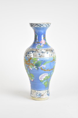 Lot 420 - A Chinese brushed-blue ground famille rose...