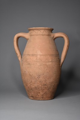 Lot 247 - A twin handled pottery jar, possibly 1st-2nd century A.D.