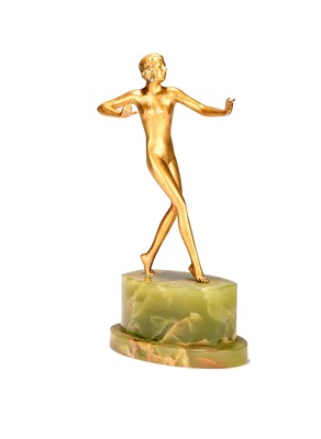 Lot 221 - An Art Deco figure of a walking nude