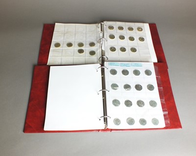 Lot 383 - Two albums of modern British silver, cupro-nickel and bronze coinage