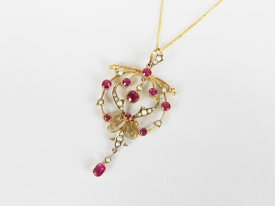 Lot 284 - An early 20th century synthetic pink sapphire and split pearl pendant