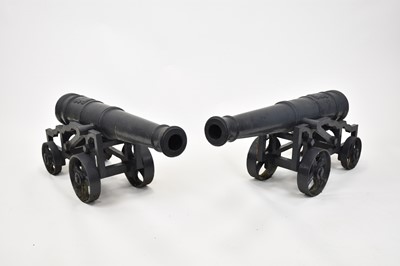 Lot 275 - A pair of cast iron ornamental cannon, each...