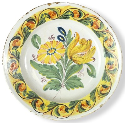 Lot 56 - A polychrome Delft dish, 18th century painted...