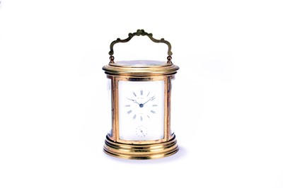 Lot 324 - An early 20th century French, oval brass carriage clock