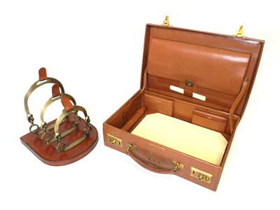 Lot 233 - A leather stationary case and letter rack