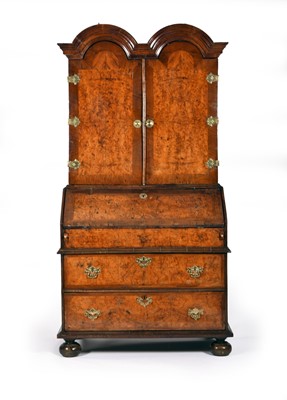 Lot 431 - A Queen Anne/George I figured walnut bureau bookcase