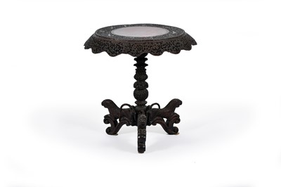 Lot 388 - A Burmese carved hardwood table