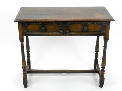 Lot 286 - A reproduction oak side table