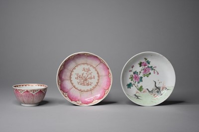 Lot 310 - A Chinese famille rose lotus teabowl and saucer and another saucer