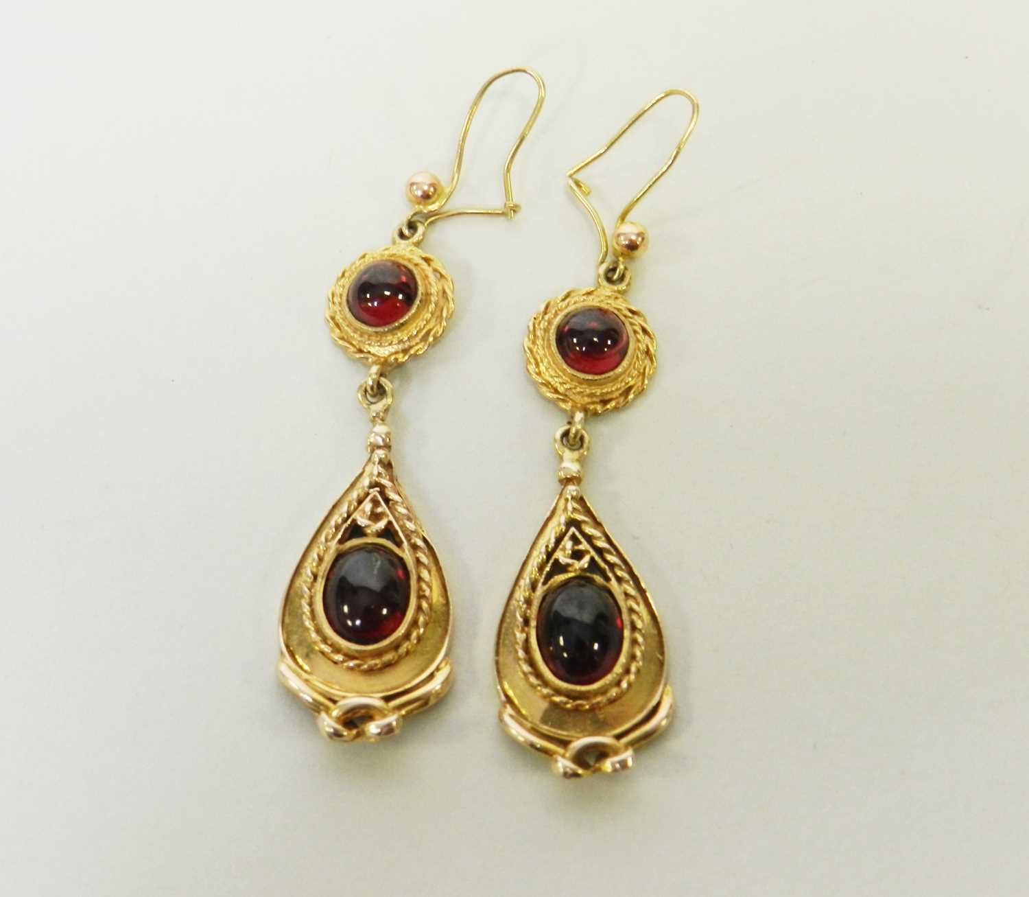 Lot 27 - A pair of 9ct gold Victorian style garnet drop ear pendants