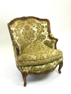 Lot 292 - A 20th century upholstered armchair