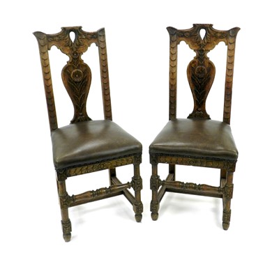 Lot 312 - A set of four Edwardian carved oak high-back...