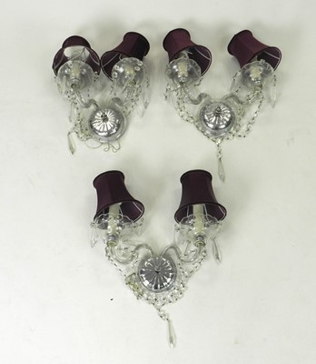 Lot 326 - A group of three cut glass twin-branch wall lighting sconces