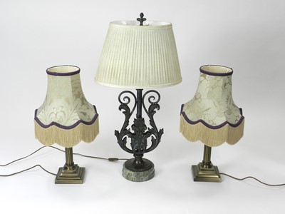 Lot 274 - A bronze and marble table lamp and a further pair of lamps