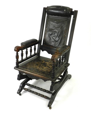 Lot 309 - An American rocking chair and an oak open armchair