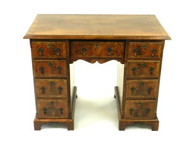 Lot 395 - A 19th century, George II style, walnut veneered twin pedestal desk