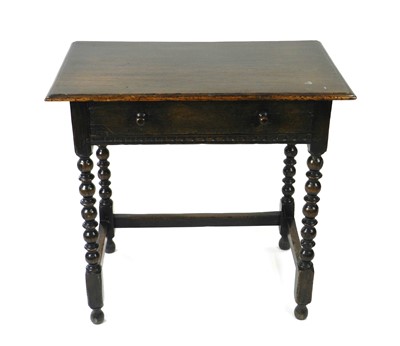 Lot 320 - An oak lowboy and joint stool