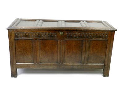 Lot 394 - A 17th century oak quadruple panelled oak coffer