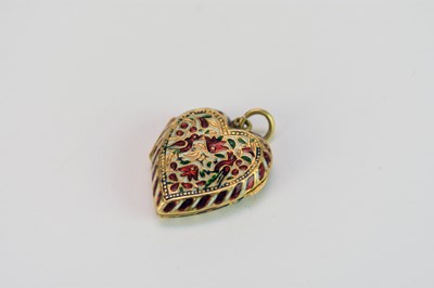 Lot 395 - A Mughal enamelled yellow metal heart pendant