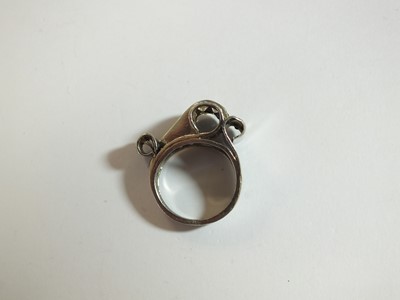 Lot 140 - An Art Deco diamond and sapphire cocktail ring
