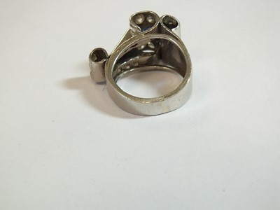 Lot 140 - An Art Deco diamond and sapphire cocktail ring