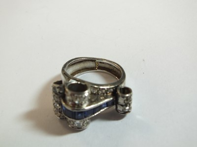 Lot 140 - An Art Deco diamond and sapphire cocktail ring